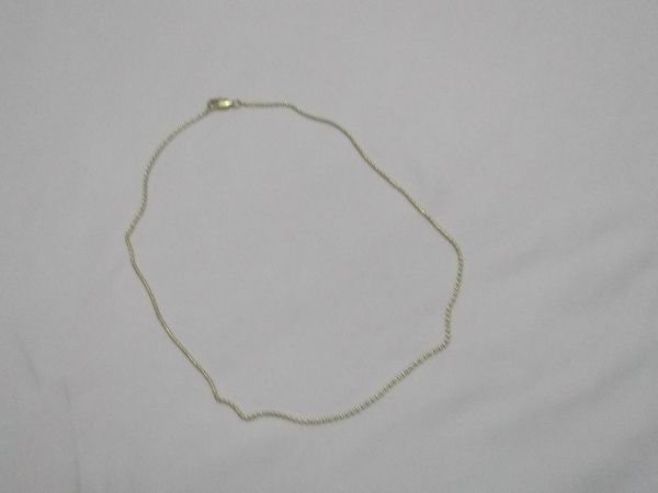 Corrente de bolinha dourada